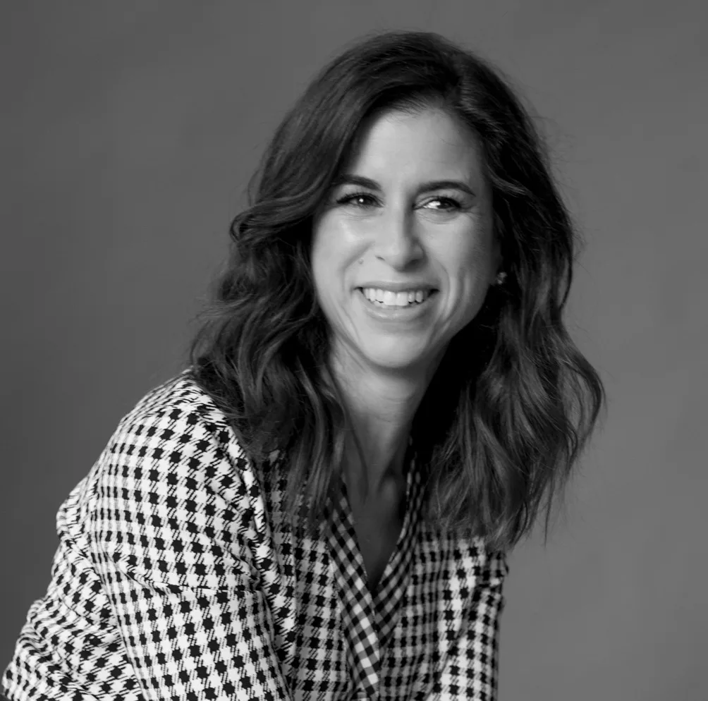 Lori Sugarman Li smiling in black and white professional portrait